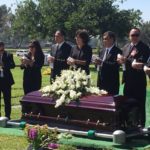 White-Dove-Release-at-Funerals-by-Romeros-White-Dove-Release-Services-Los-Angeles-CA-Family-Preparing-to-Releasie-White-Doves-at-Cemetery