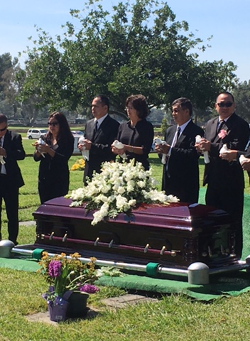 White-Dove-Release-at-Funerals-by-Romeros-White-Dove-Release-Services-Los-Angeles-CA-Family-Preparing-to-Releasie-White-Doves-at-Cemetery